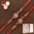 Ghasitaram Gifts Rakhi for Brother Rakhis Online – Set of 2 BW-5410 and BW-5414 Om Ganesh Divine Rakhis with 200 GMS of Kaju katli