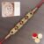 Ghasitaram Gifts Rakhi for Brother Rakhis Online- LD-5817 Om Ganesha Bracelet Rakhi with 200 GMS of Kaju katli